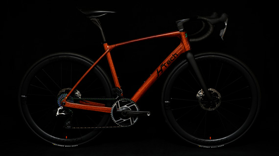 Jarrah HTech Aeriform with SRAM Red E1, Vision Metron wheels and cockpit, on dark background highlighting the wooden frame, Small Image