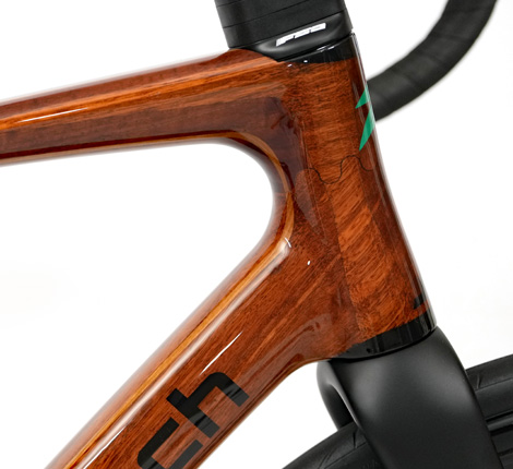 A HTech LOC joint on the wooden headtube of a HTech Aeriform, joining the top tube and down tube together