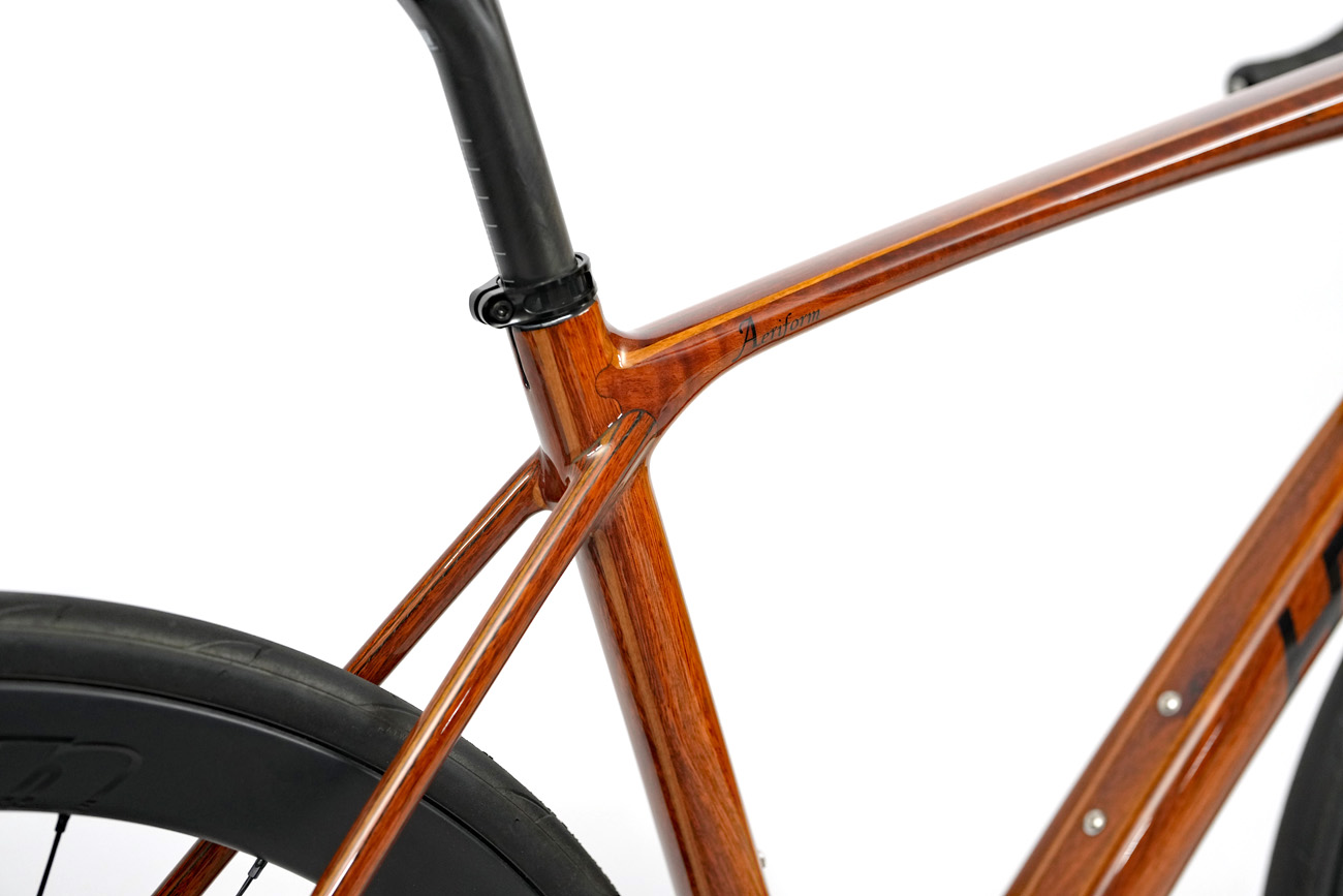 Wooden HTech Aeriform seat tube junction highlighting the precision joinery and wood grain details