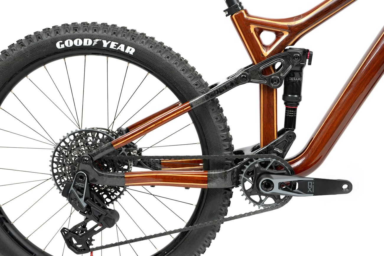 The precision crafted blend of carbon fiber and wood to create the floating linkage mountain bike suspension