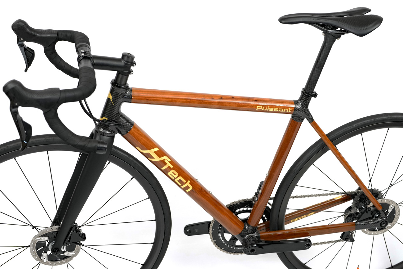 HTech Puissant W with distinctive lugged tube construction, Brown Mallet HRP tubes, and 3K twill carbon fiber lugs
